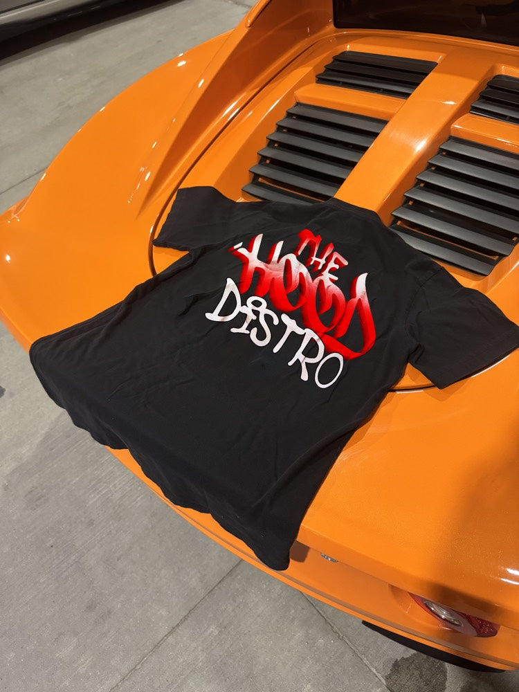Wordmark tee on a carbon fibre hood